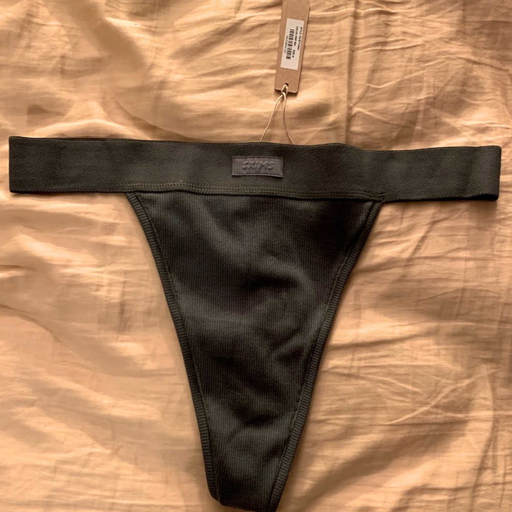 Skims Cotton Rib Thong in the color Deep Sea
